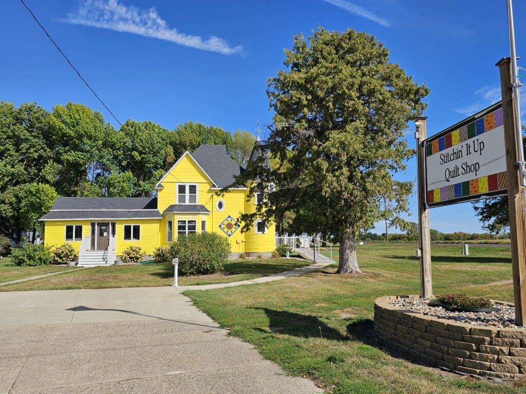 Stitching It Up Quilt Shop Yellow Building